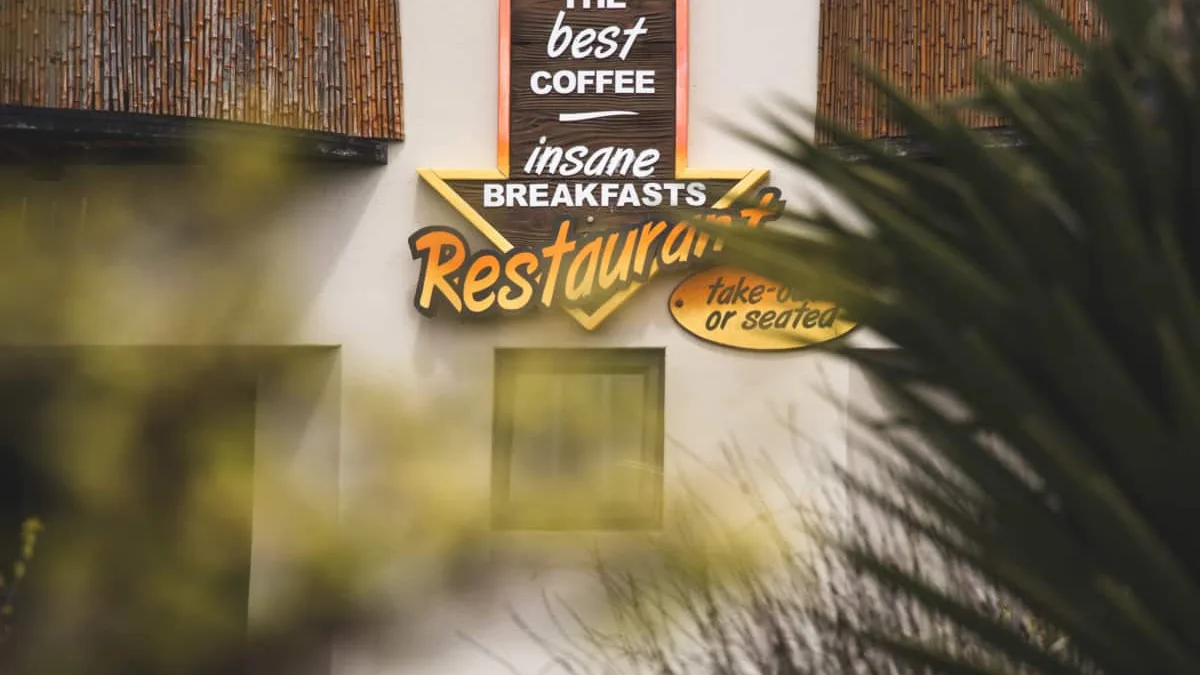 Sign pointing to African Perfection Restaurant
